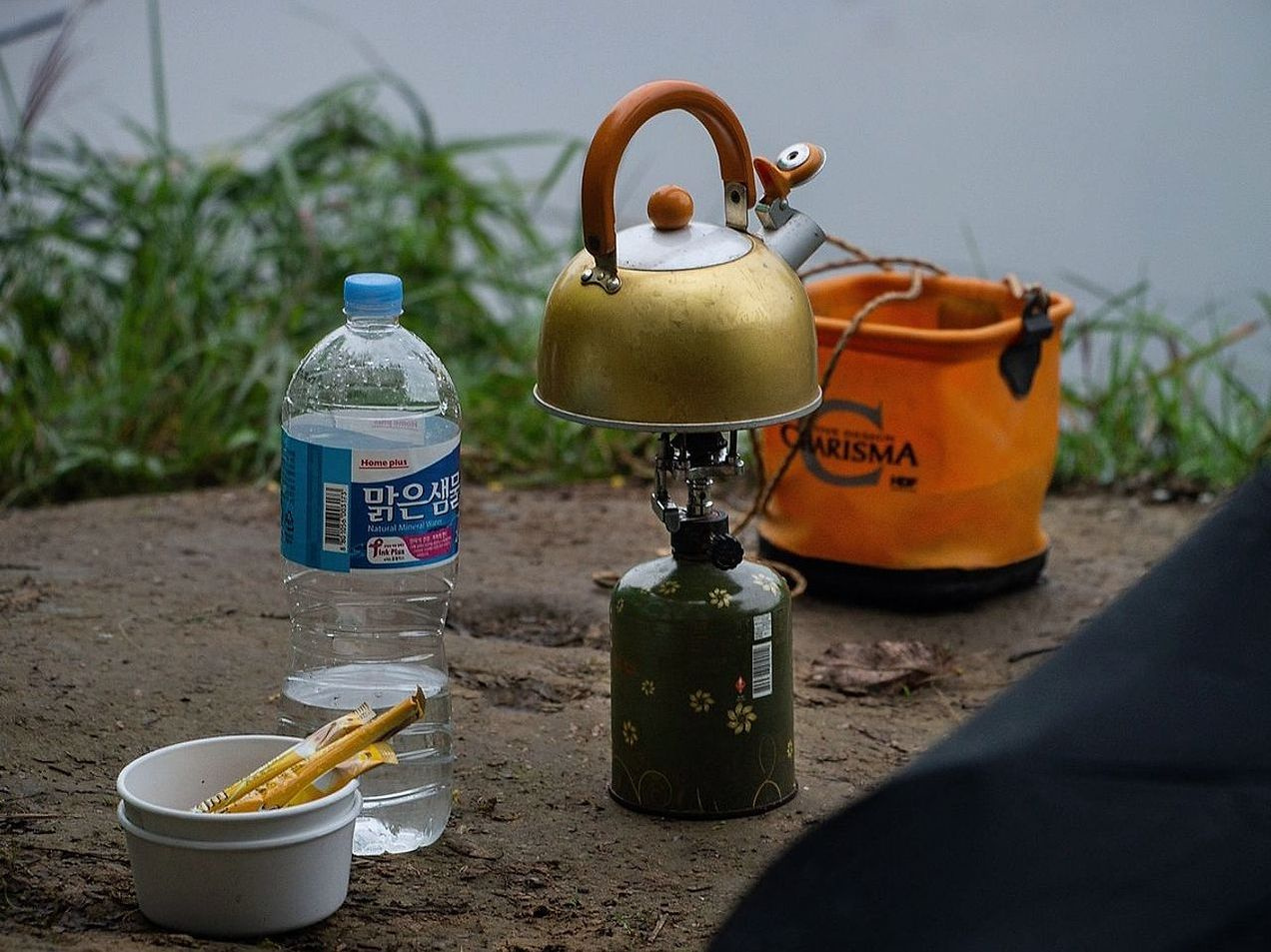 Open ridgeline with mountain peaks on the horizon