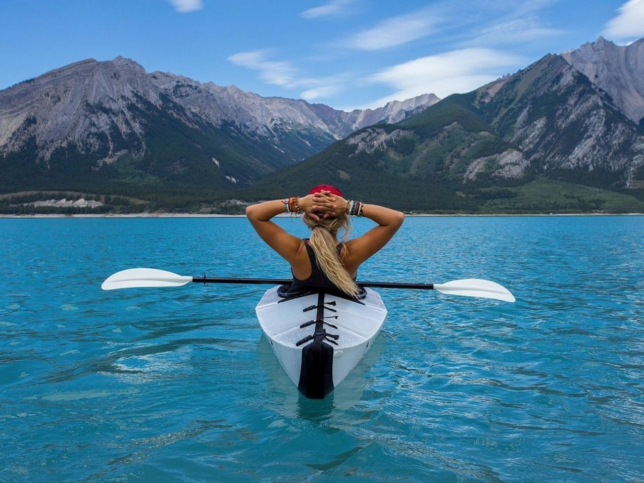 Kayaks lined up on the shore before launch